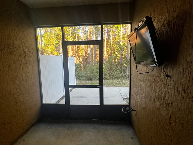 Screen porch with wall mounted TV