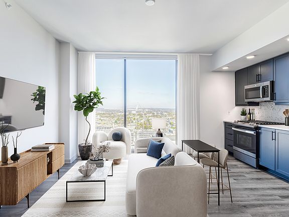 Studio with Floor to Ceiling Windows with a View of the City.