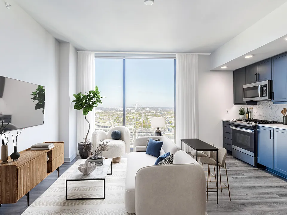 Studio with Floor to Ceiling Windows with a View of the City.