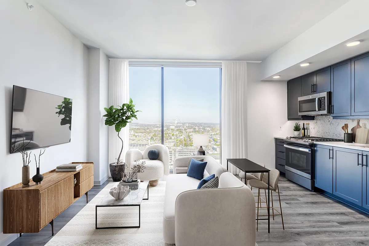 Studio with Floor to Ceiling Windows with a View of the City. - Fallyn