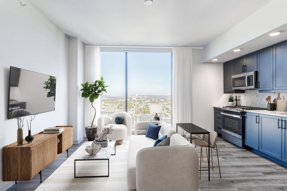 Studio with Floor to Ceiling Windows with a View of the City.