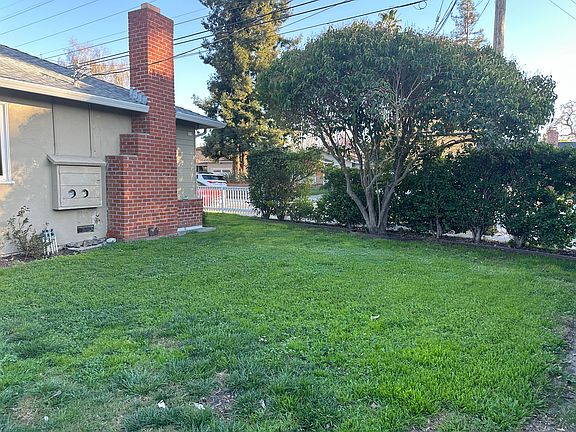 Side yard offering additional outdoor space to relax or enjoy fresh air.