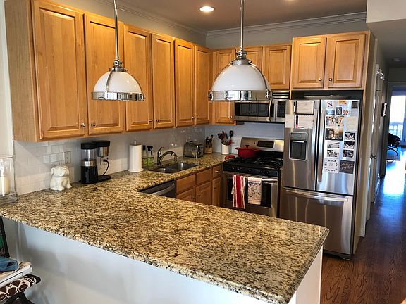 As previously furnished. Kitchen area. Fridge and dishwasher are new as of 2018.