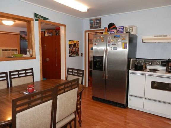 Informal eat-in kitchen....with electric range & refrigerator