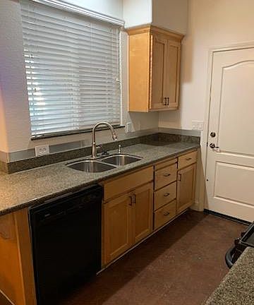 galley kitchen and door to garage