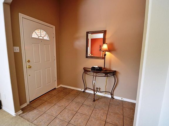 Inviting foyer with tile.