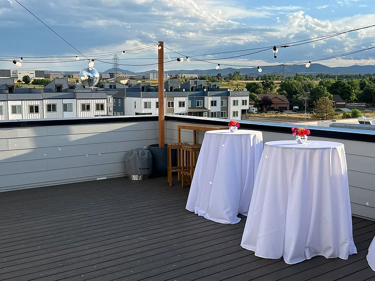 Our private 4th-floor rooftop oasis with panoramic mountain views. Please note: This photo highlights a past birthday celebration layout.