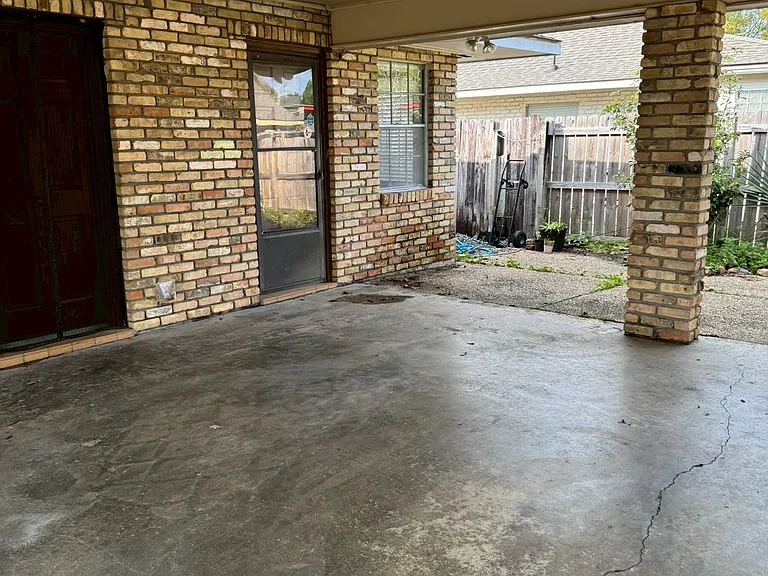 __ Garage
"Open garage with rooftop covering for 2 cars _ offers shade and protection from weather, with direct access to the house."