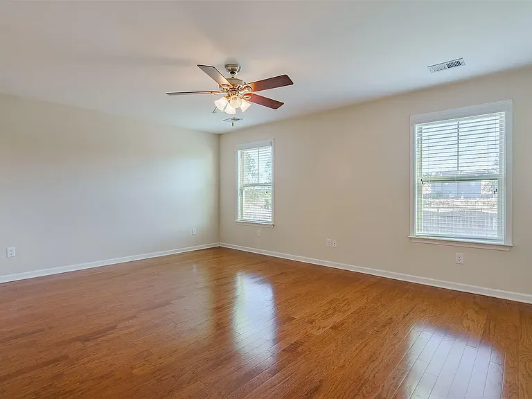 Beautiful large primary suite on the main level of the home with large closet and bathroom.