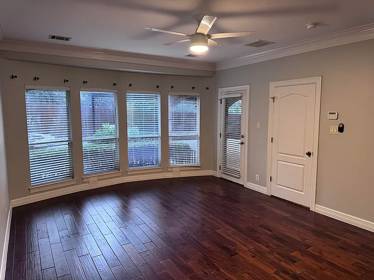 Primary Bedroom with hardwood floors