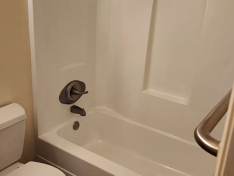 Bathroom with newly refinished tub/shower.