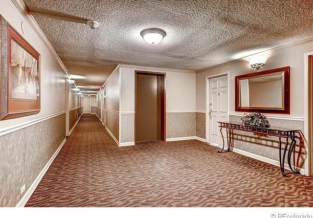 Two elevators on lobby and hallway