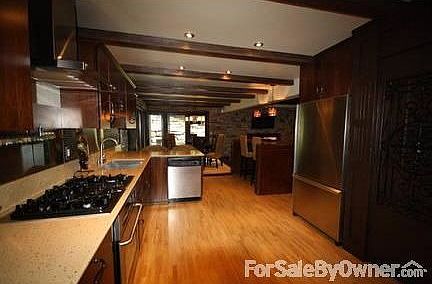 Sunken Living room
						:
						Stacked stone wall, Concrete wood burning fireplace, Huge wood beams, Very open!