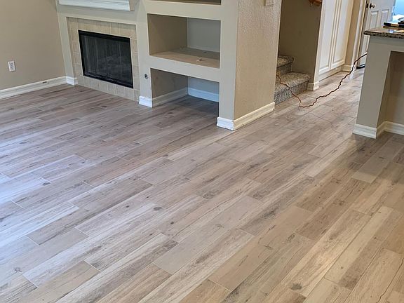 View from front door into living/dining areas. New flooring installed August 2022