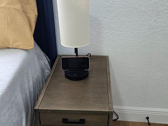 Bedside lamp with USB and phone holder