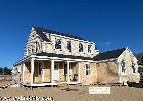This structure is not located at 1 Lilac Court. This single-family home was constructed on a neighboring lot.