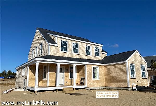 This structure is not located at 1 Lilac Court. This single-family home was constructed on a neighboring lot.