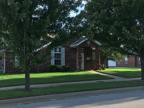 Front of house with trees