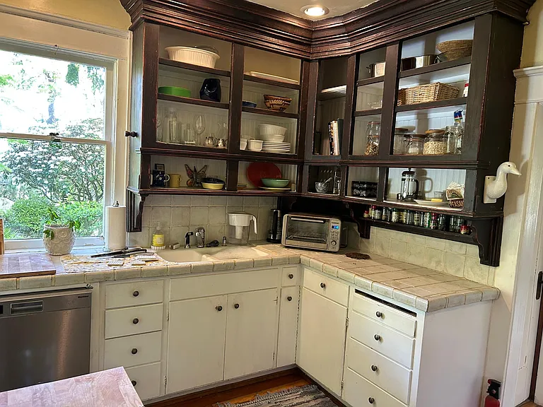 Open shelves reach to the ceiling, and functional as well as artistic.