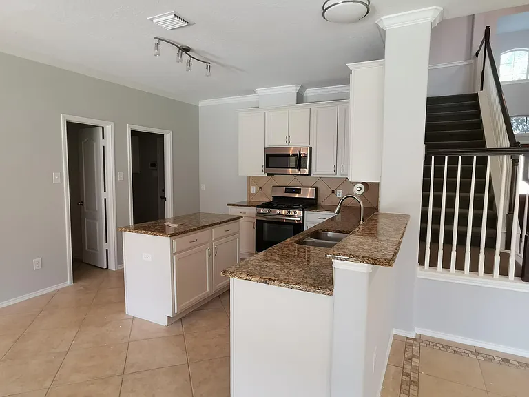 Kitchen with granite countertop and an island