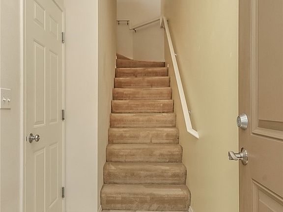 Entry way and door to the left is the garage. 