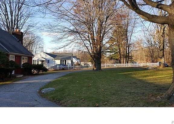 Circular driveway and nice front yard