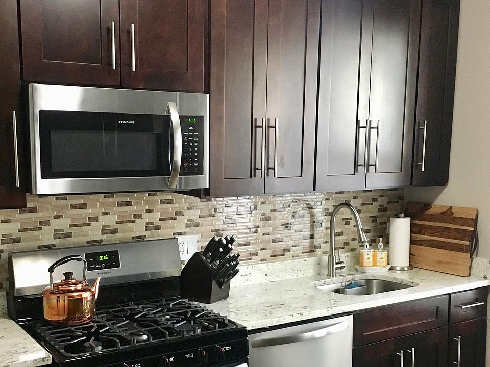 New kitchen with stainless steel appliances