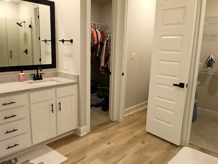 Both closets in master bedroom accessible through bathroom