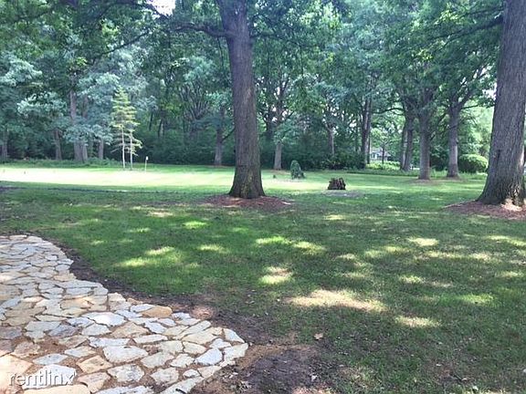 Backyard - sits on 1.38 acres! Lawn and snow removal include