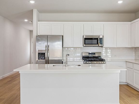 Kitchen in the Stanley II home plan by Trophy Signature Homes - REPRESENTATIVE PHOTO