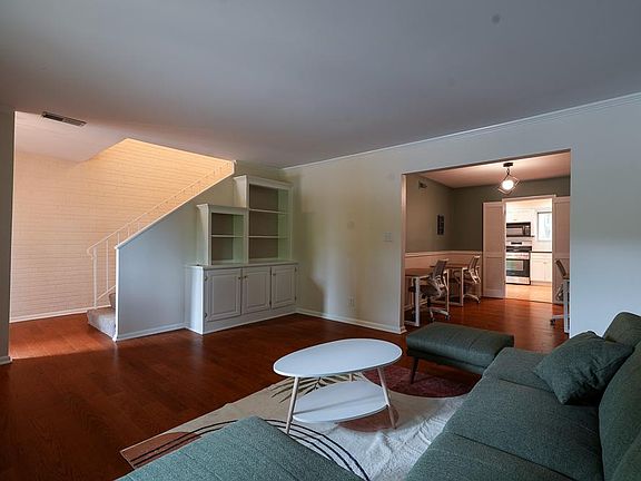 Large furnished living room with built-in shelving.