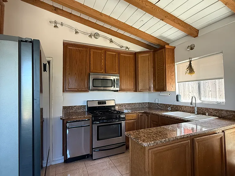Kitchen with new appliances (garbage disposal, french door refrigerator beverage center, dishwasher) and microwave