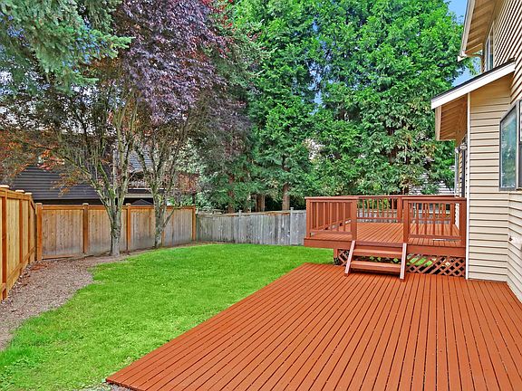 Entertainment size deck with fenced backyard