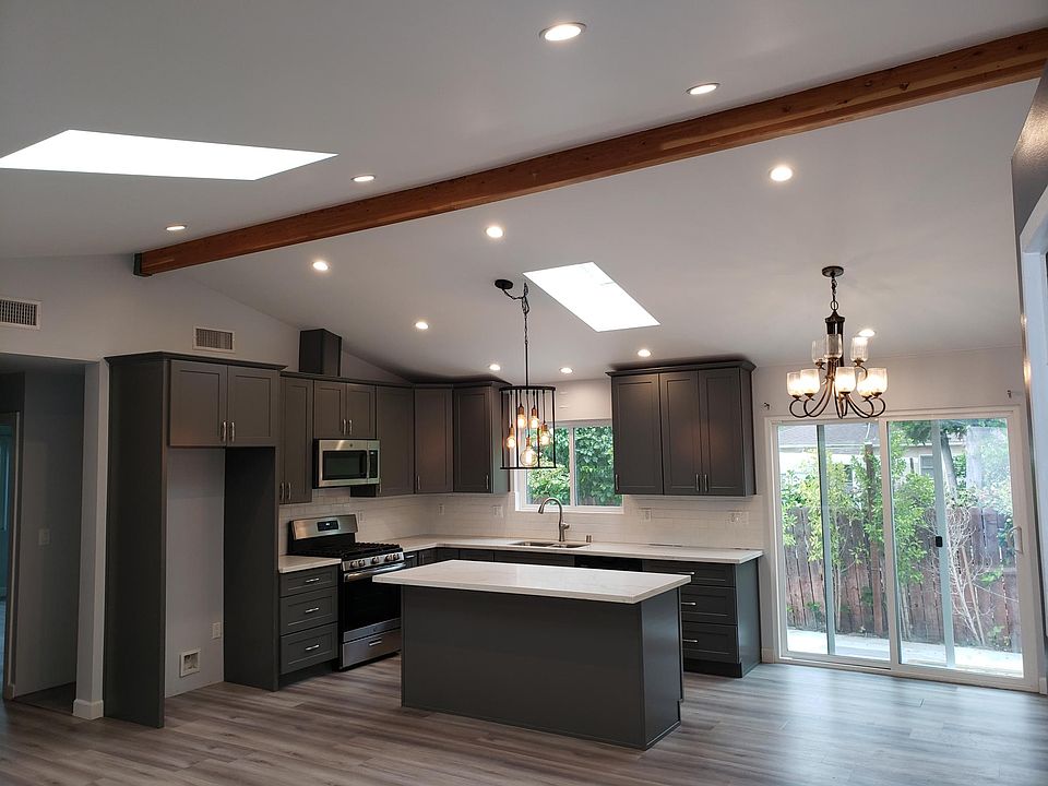 Beautiful kitchen with quartz island and stainless steal appliances
