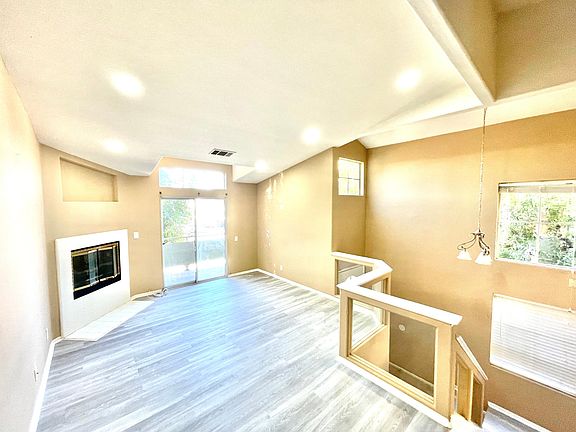 Open Floor plan, New Flooring, & New Recessed Lighting. This end townhome unit has a private balcony to extend the open floorpan.