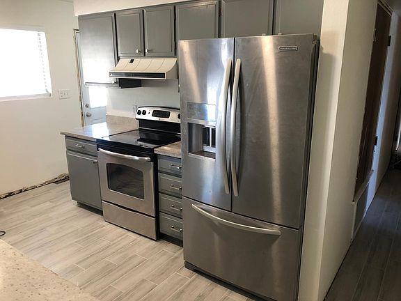 Stainless steel appliances and a new low profile microwave over the stove