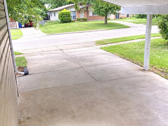Convenient covered carport provides sheltered off street parking and easy access to the home.