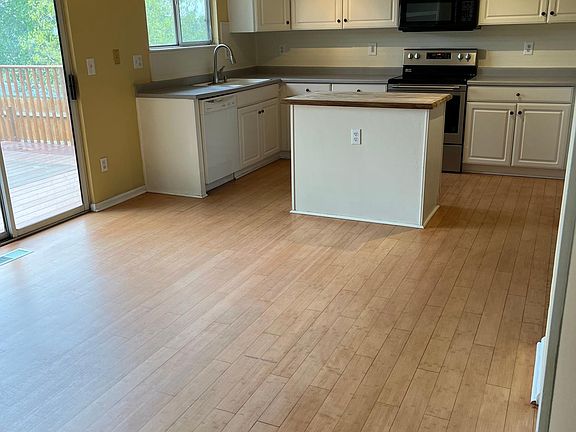 Open concept kitchen and eating space that opens to backyard deck. Lot_s of room and natural light.