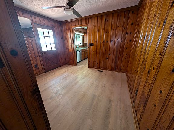 Breakfast room looking to kitchen and door to deck