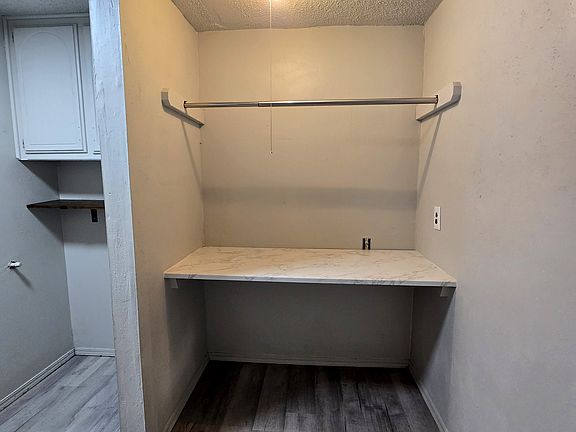 Laundry room with washer / dryer hookups and folding station.