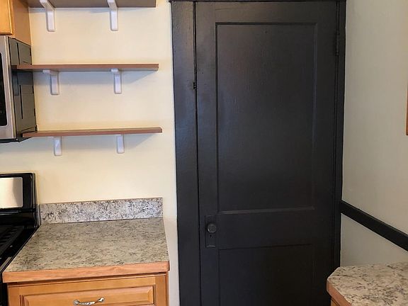 Door to basement through kitchen