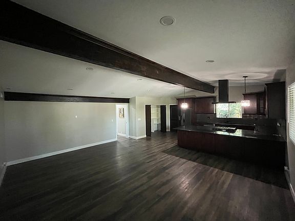 Living Room Open-Concept Vaulted Ceilings w/ Exposed Beams