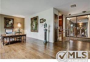Spacious entry looks into pool area