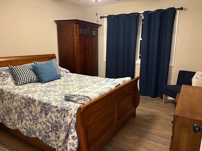 The second bedroom which looks out on the river and has a large walk in closet.