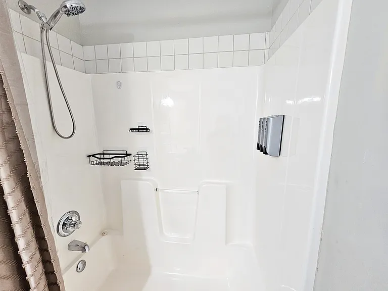 Brand new spa handheld shower head and dispensary. Plenty of in-shower storage as well.