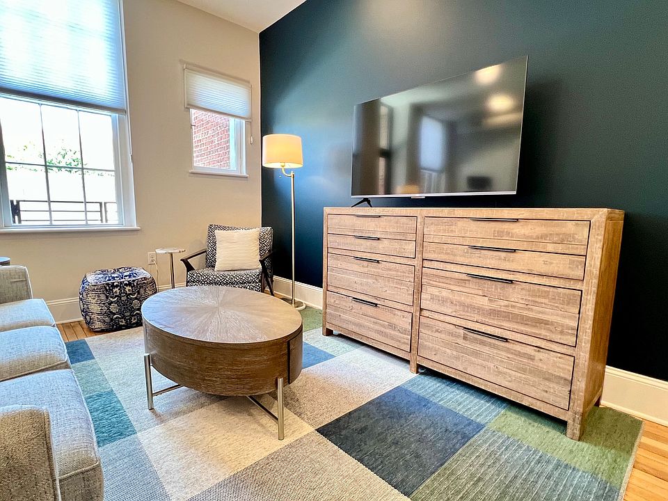 Living area. Clean, modern lines, high quality furniture with lots of built-in storage.