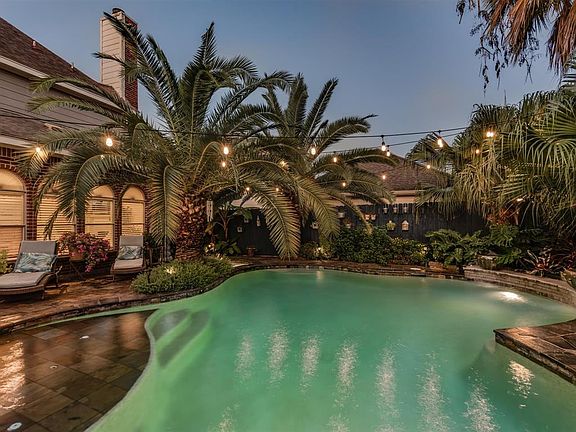 Complete with lush landscape, a beach-entry pool and huge covered patio makes this an entertaining dream home.