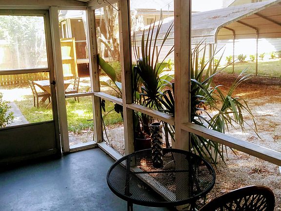 Screened Porch with view of Carport