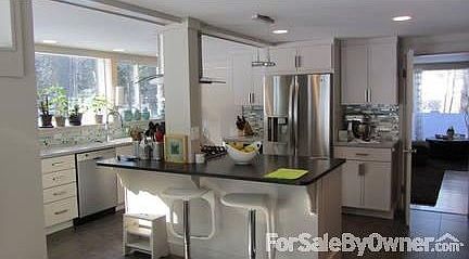 Living/ Dining/ new windows/ built-ins
						:
						Spacious, sunny, fireplace/woodstove, new lighting throughout, bookshelves