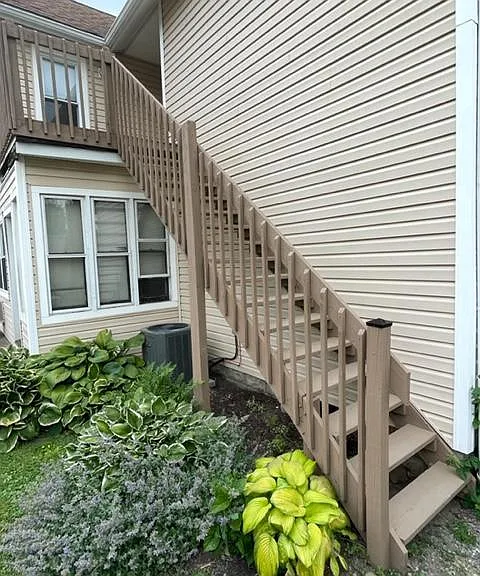 The second floor apartment has its own exterior stairs to its private deck patio and entrance.